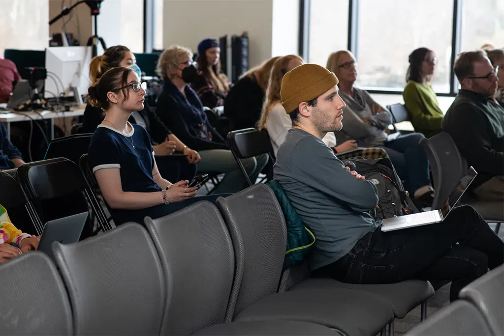 U N E students sitting at a climate lecture