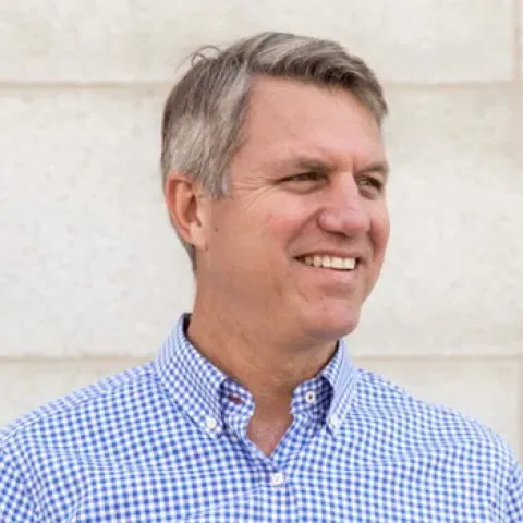 Headshot of U N E trustee Jim Brady