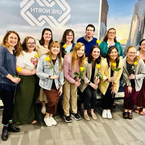 LEND trainees smiling with flowers